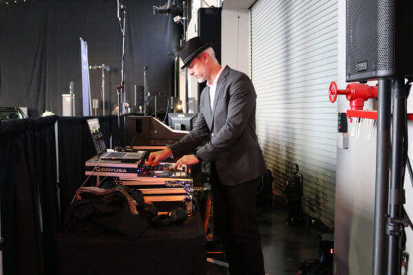 Side view of DJ Greg set up at Automobile event