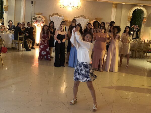 Chinese American Wedding NY Leonards in Great Neck bride throwing bouquet